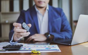 Concept of business finance and sale marketing people holding car model with key of a car car sale